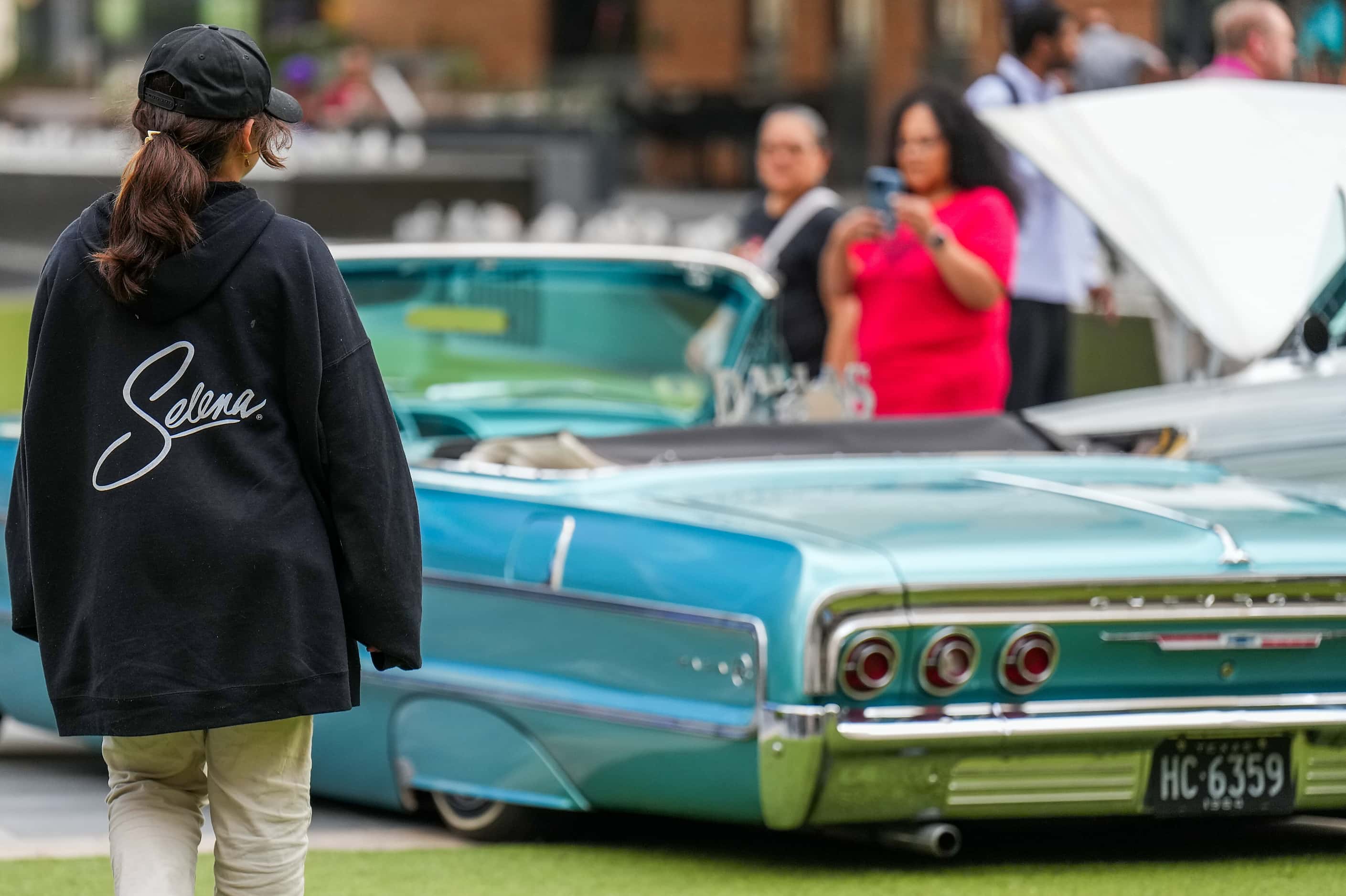People check ouf a display of low riders during a celebration of the life of singer Selena...