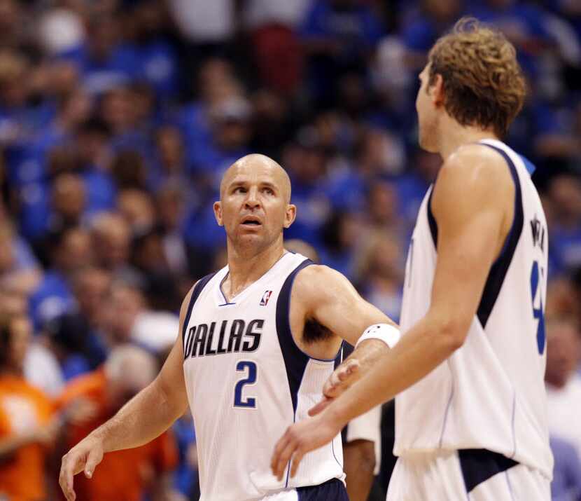 Dallas Mavericks point guard Jason Kidd (2) talks with Dallas Mavericks power forward Dirk...