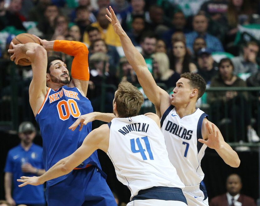 Dallas Mavericks forward Dirk Nowitzki (41) and forward Dwight Powell (7) defend against New...