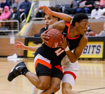 Lancaster's Wade Taylor IV (4) drives past Kimball's Jayden Blair (0) during the first half...