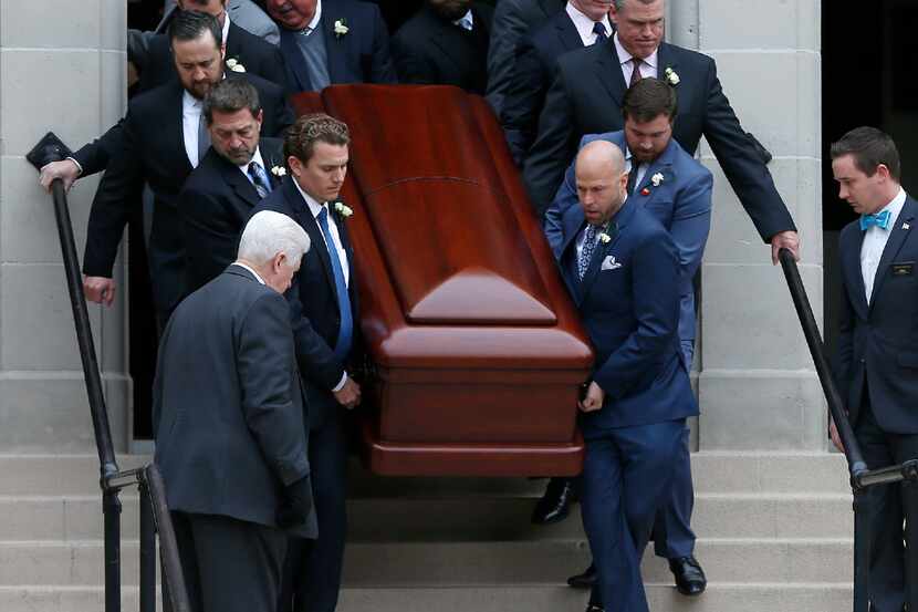 Pallbearers carried the casket of Brian Loncar down the front steps of the Munger Place...