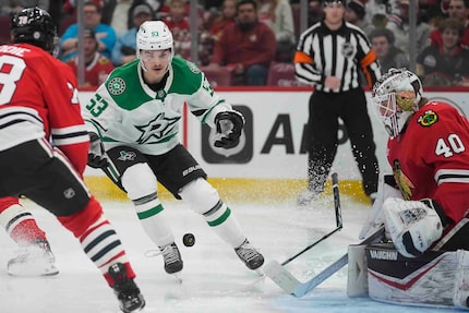 Dallas Stars center Wyatt Johnston breaks and loses his stick as he scores on Chicago...