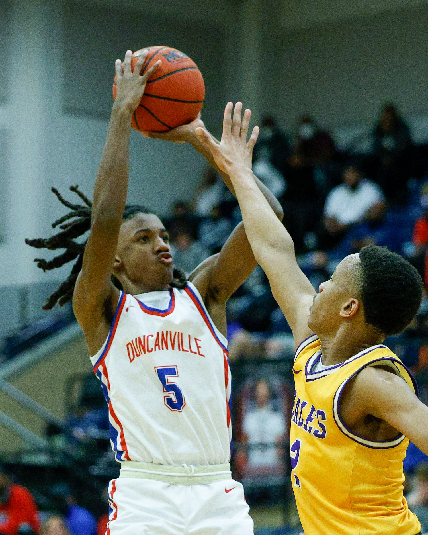 Duncanville guard Kayden Edwards (5) shoots over Richardson guard Pharaoh Amadi (2) during...