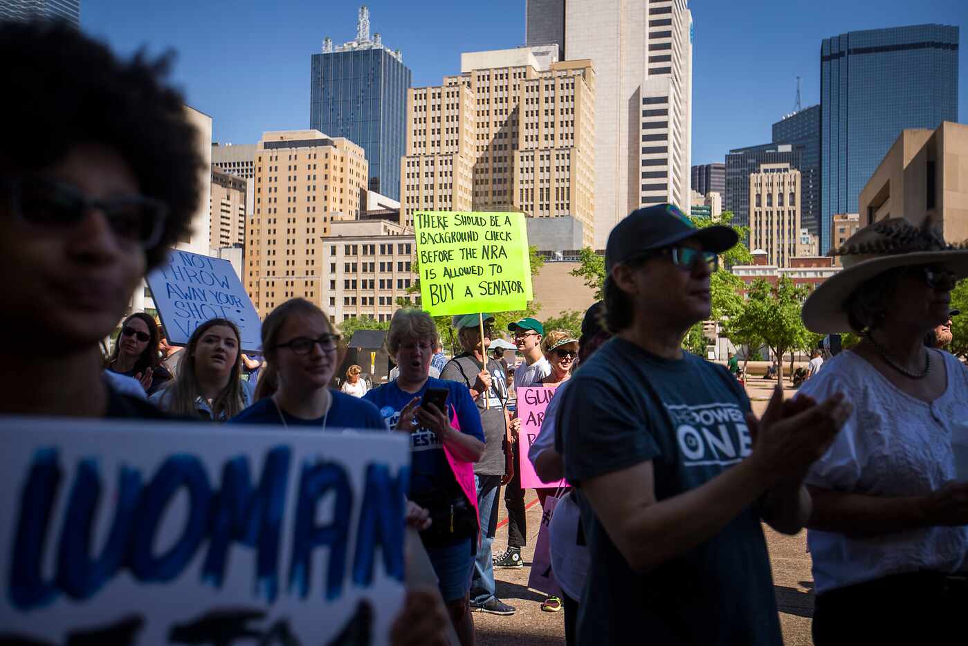 Gun control advocates demonstrate outside Dallas City Hall at a rally organized by...