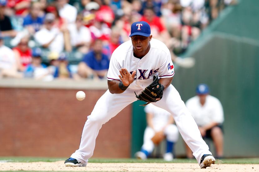 Rangers third baseman Adrian Beltre (29) fields a ground ball in the eighth inning of the...