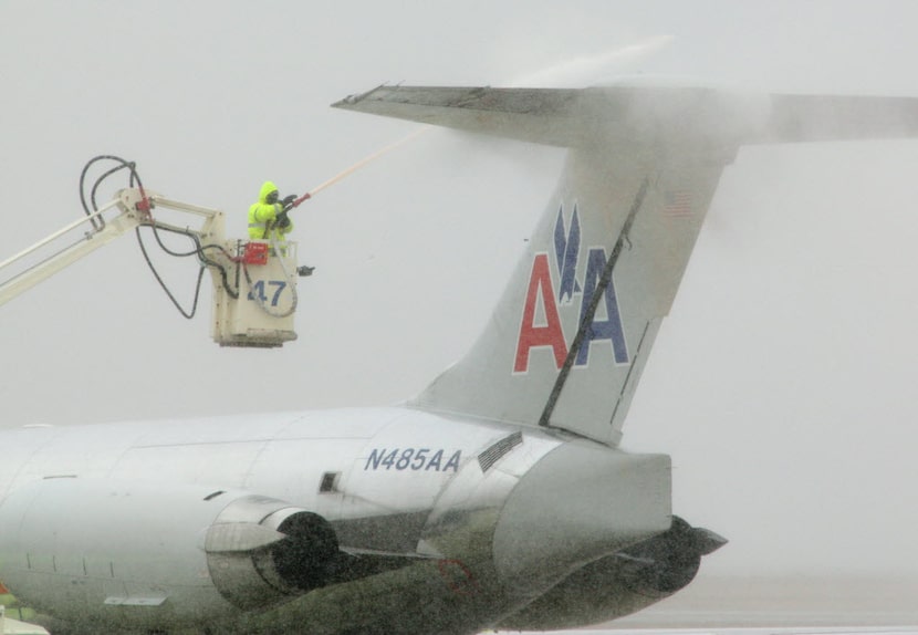 American Airlines ground crews de-iced jets at DFW International Airport on Dec. 24, 2009.