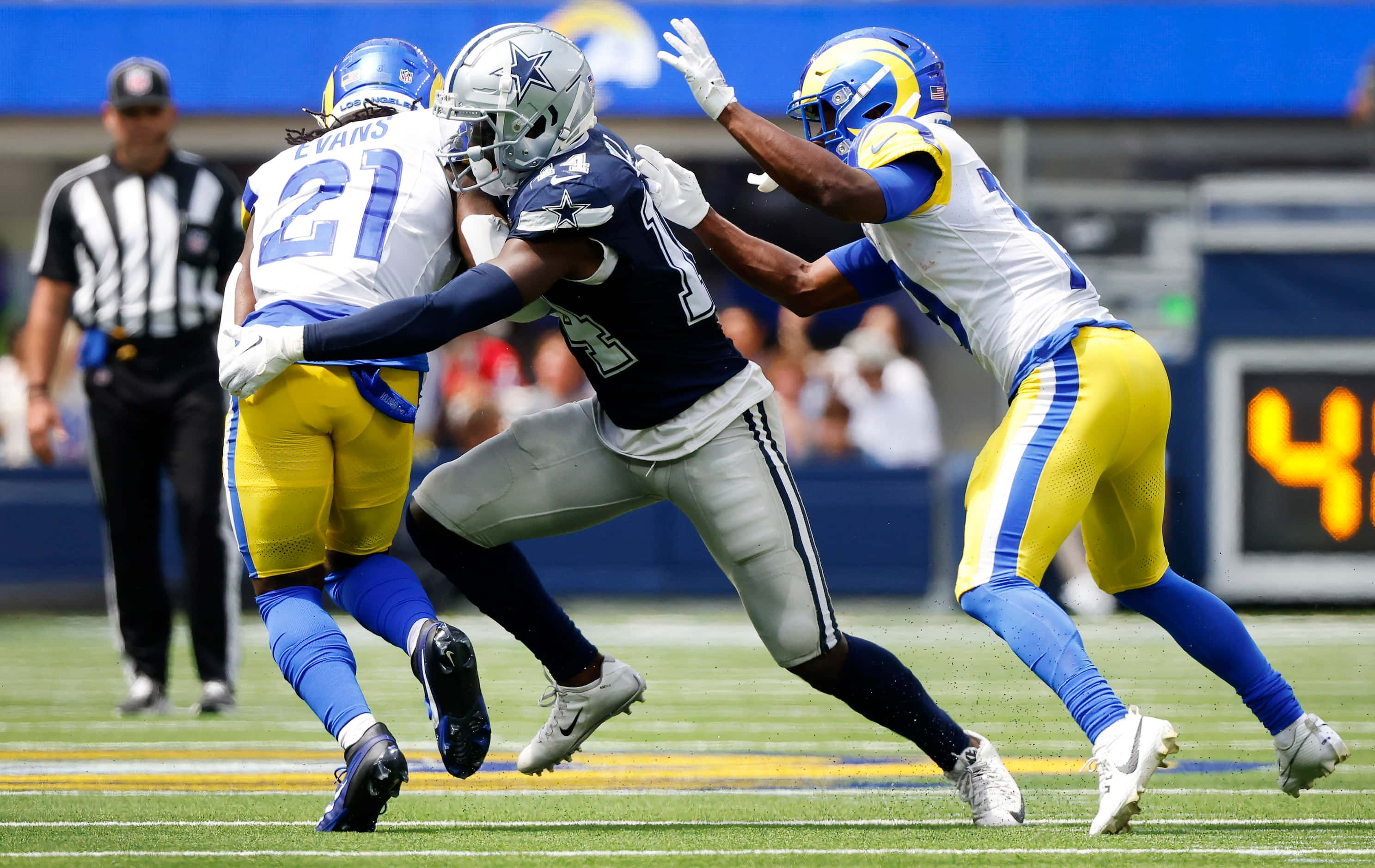 Dallas Cowboys safety Markquese Bell (14) tackles Los Angeles Rams running back Zach Evans...