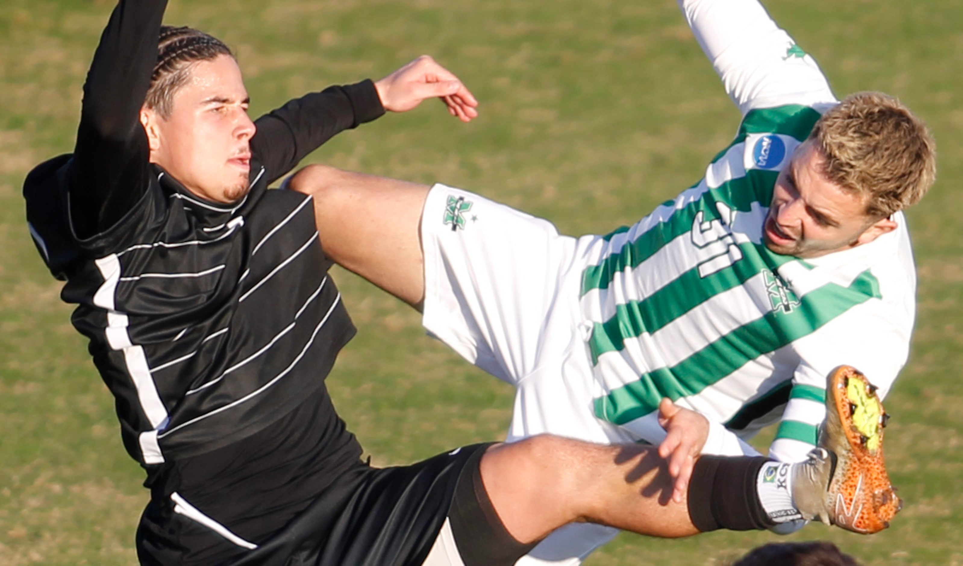 SMU Mustangs midfielder Kyran Chambron Pinho (7), left, collides with Marshall defenseman...