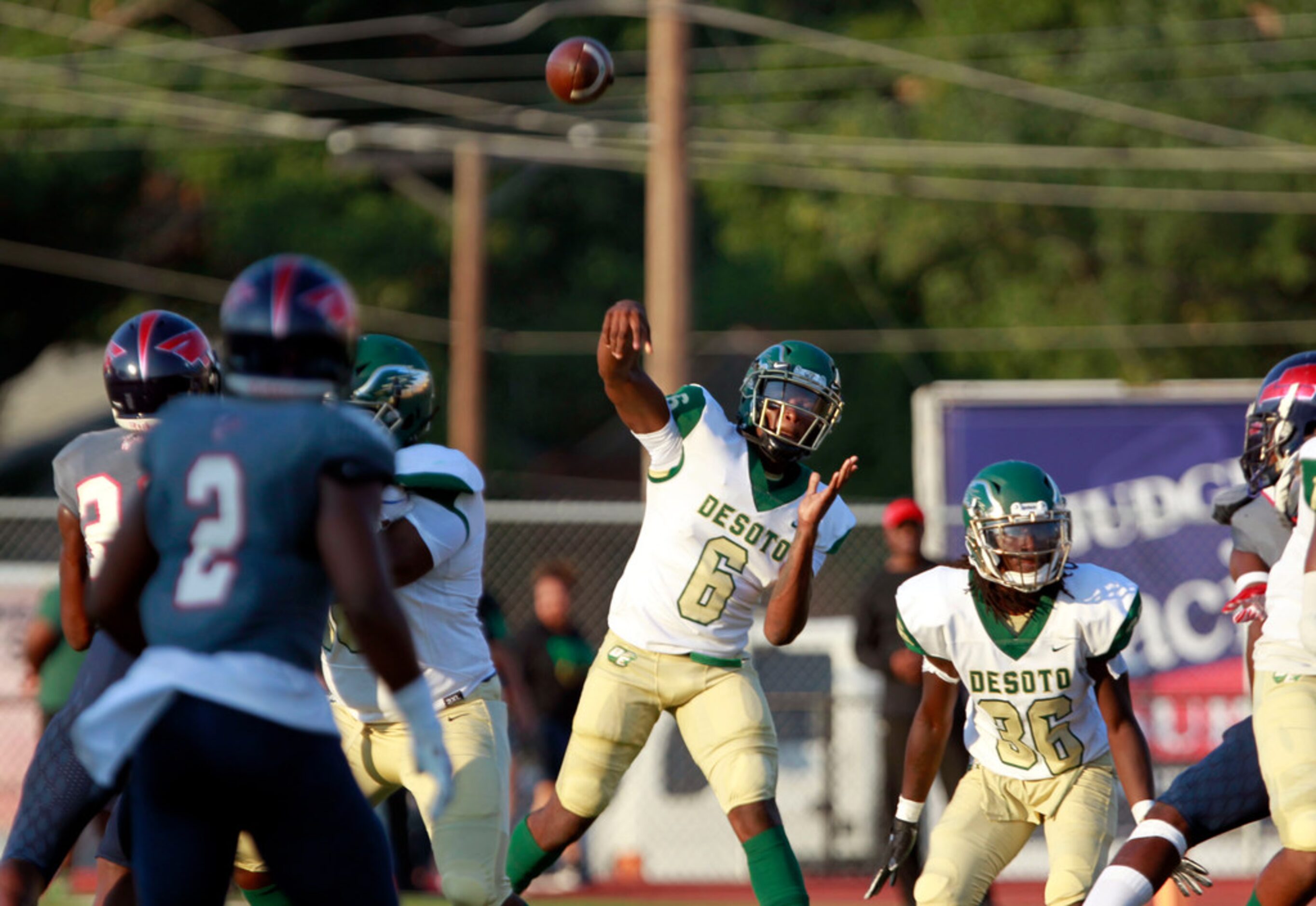 Desoto QB Samari Collier (6) throws a pass during the first half of their high school...