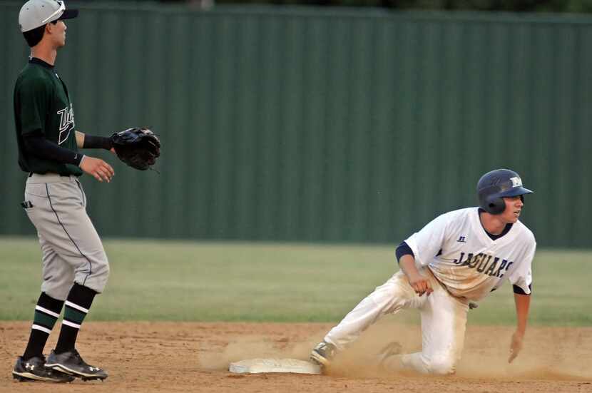Flower Mound's Sean Wymer (25) makes it safely to second base past Southlake Carroll's Joe...