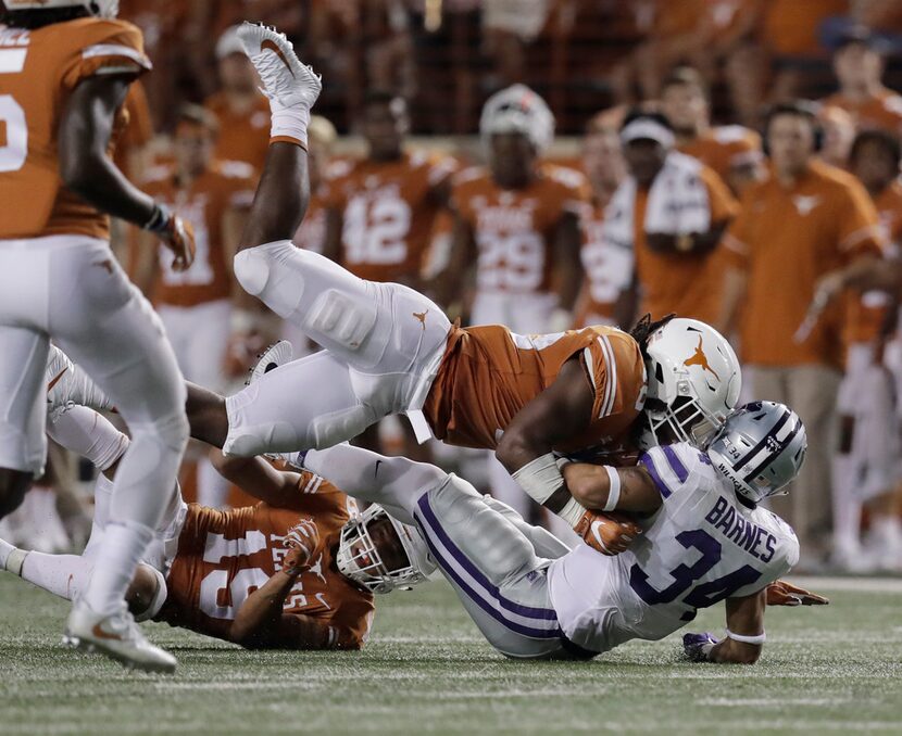 FILE - In this Oct. 7, 2017, file photo, Texas linebacker Malik Jefferson (46) hits Kansas...