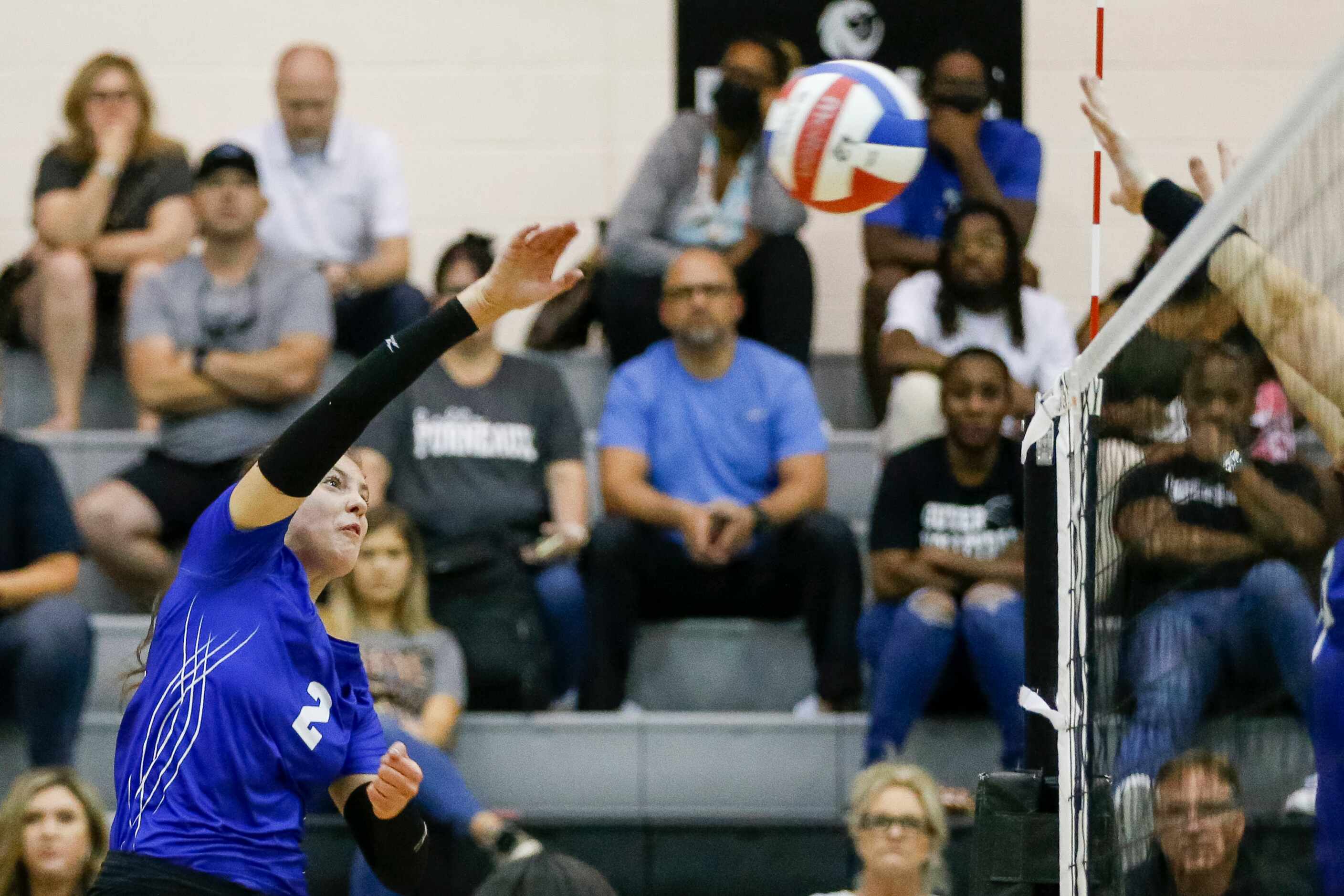 Denton Guyer defensive specialist Gracey Campbell (2) spikes the ball during the first set...