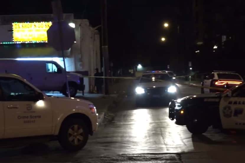 Crime tape marks an area near a business at Hall Street and Munger Avenue where shots were...