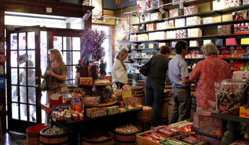 People browse the huge selection of candy at Mom & Popcorn in McKinney. There's a wholesome,...