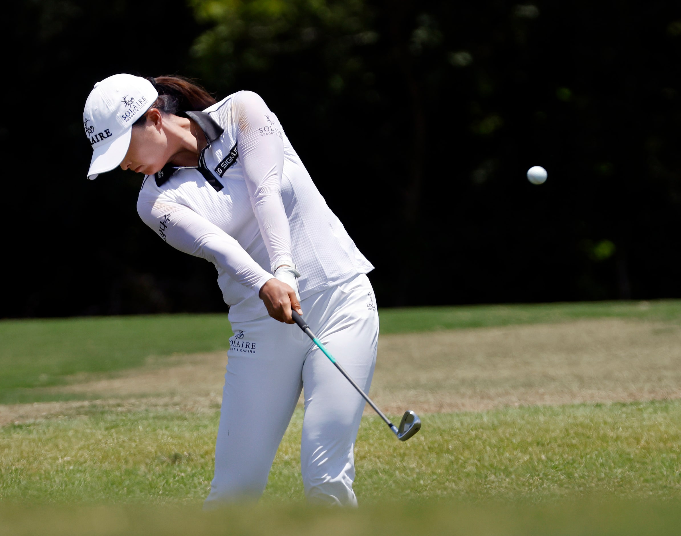 Professional golfer Jin Young Ko hits her approach shot on No. 9 during the opening round of...