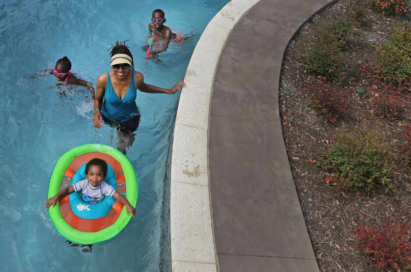 Swimmers on Friday enjoyed a trip on the lazy river at JadeWaters
at the Hilton Anatole...