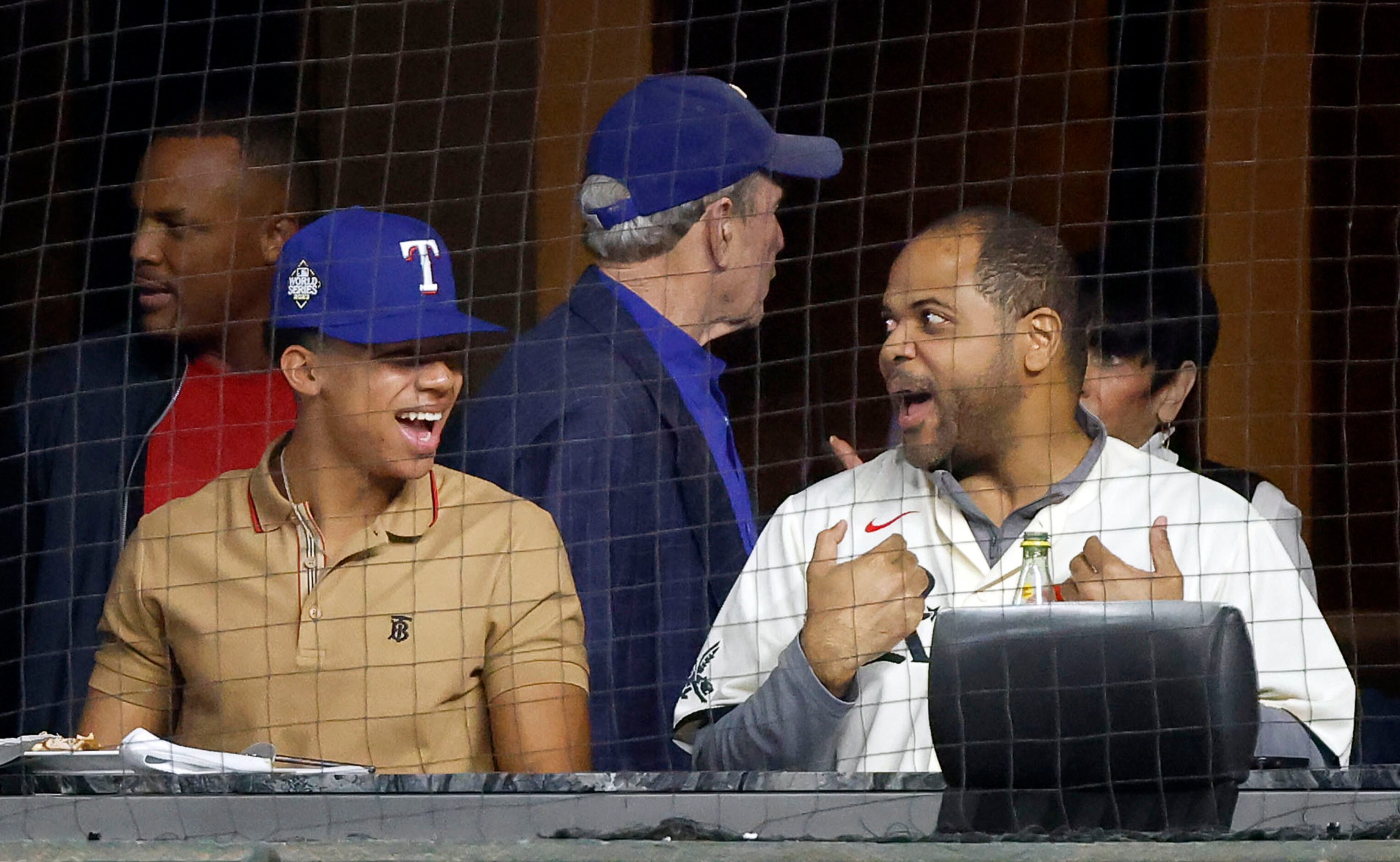 Dallas Mayor Eric Johnson (right) visits with Adrian Beltre’s son Adrian Beltre, Jr. during...