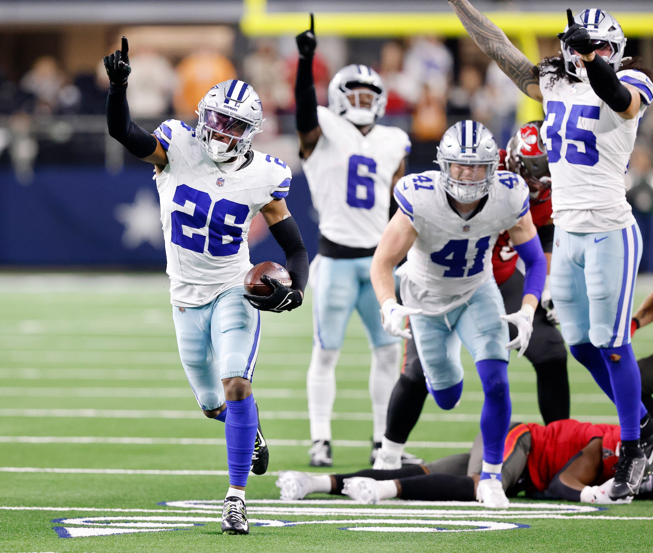 Dallas Cowboys cornerback DaRon Bland (26) celebrates after ripping the ball from Tampa Bay...