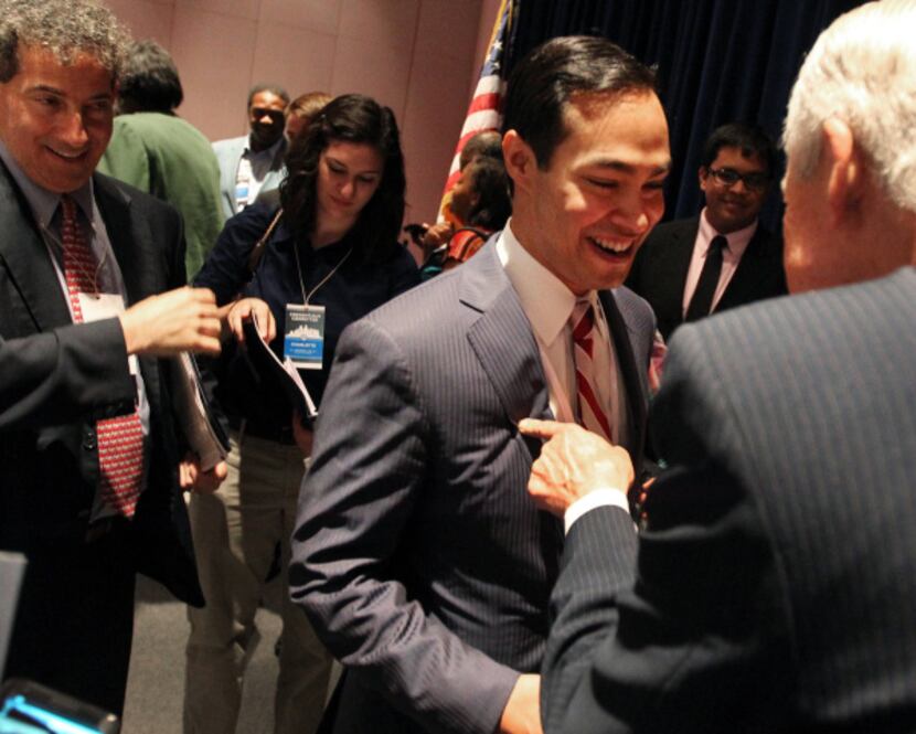 San Antonio Mayor Julian Castro (center) talked with Fred Head, a former legislator from...