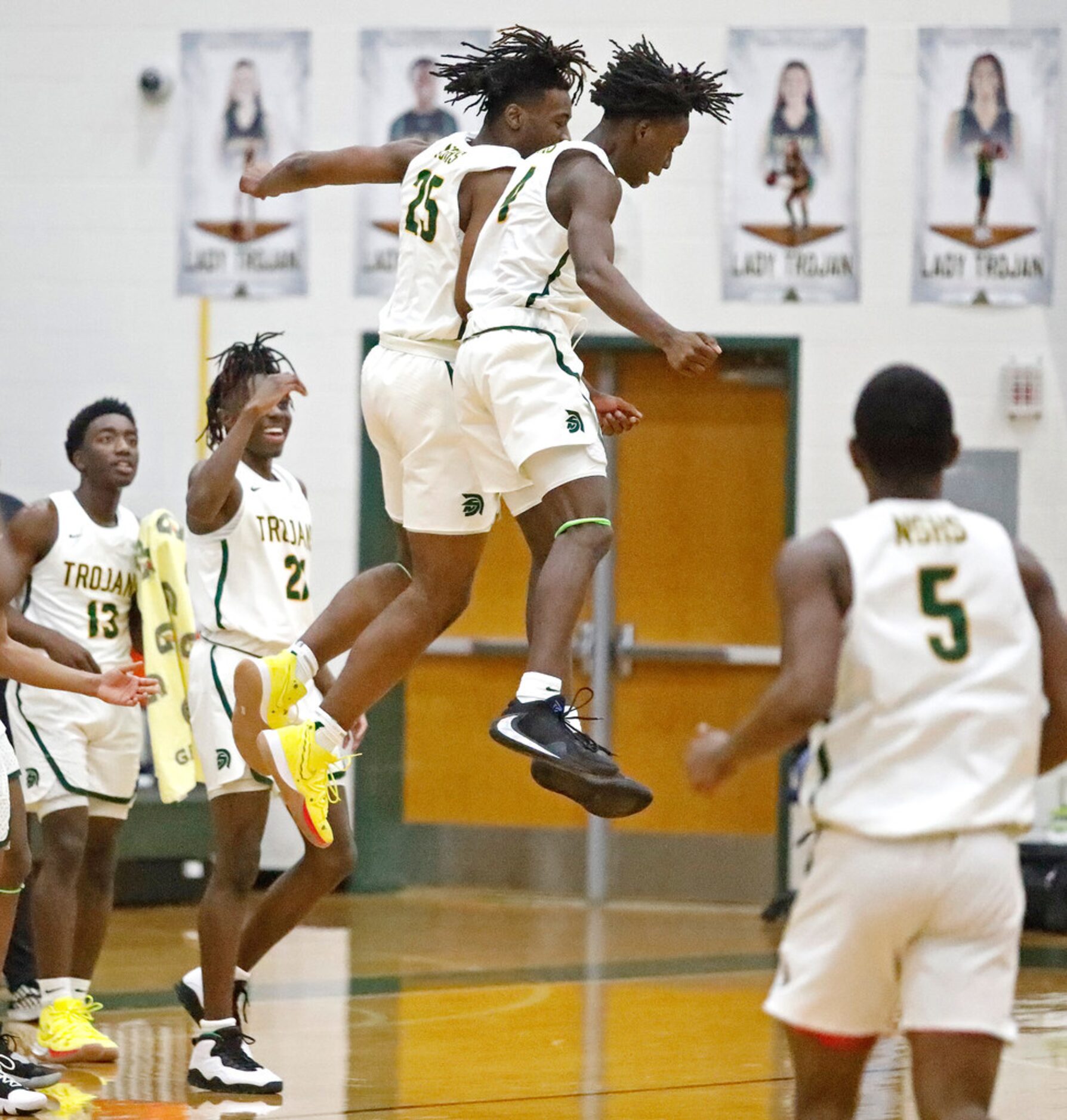 Newman Smith High School forward Domani Villaruel (25) and Newman Smith High School guard...