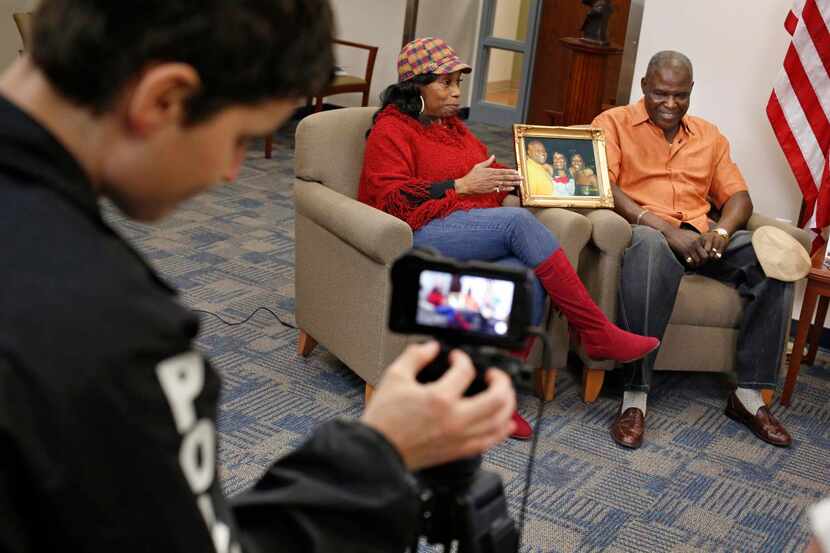 
Police spokeswoman Monica Cordova films Evelyn and Earnest Griffith Sr. for a video to post...