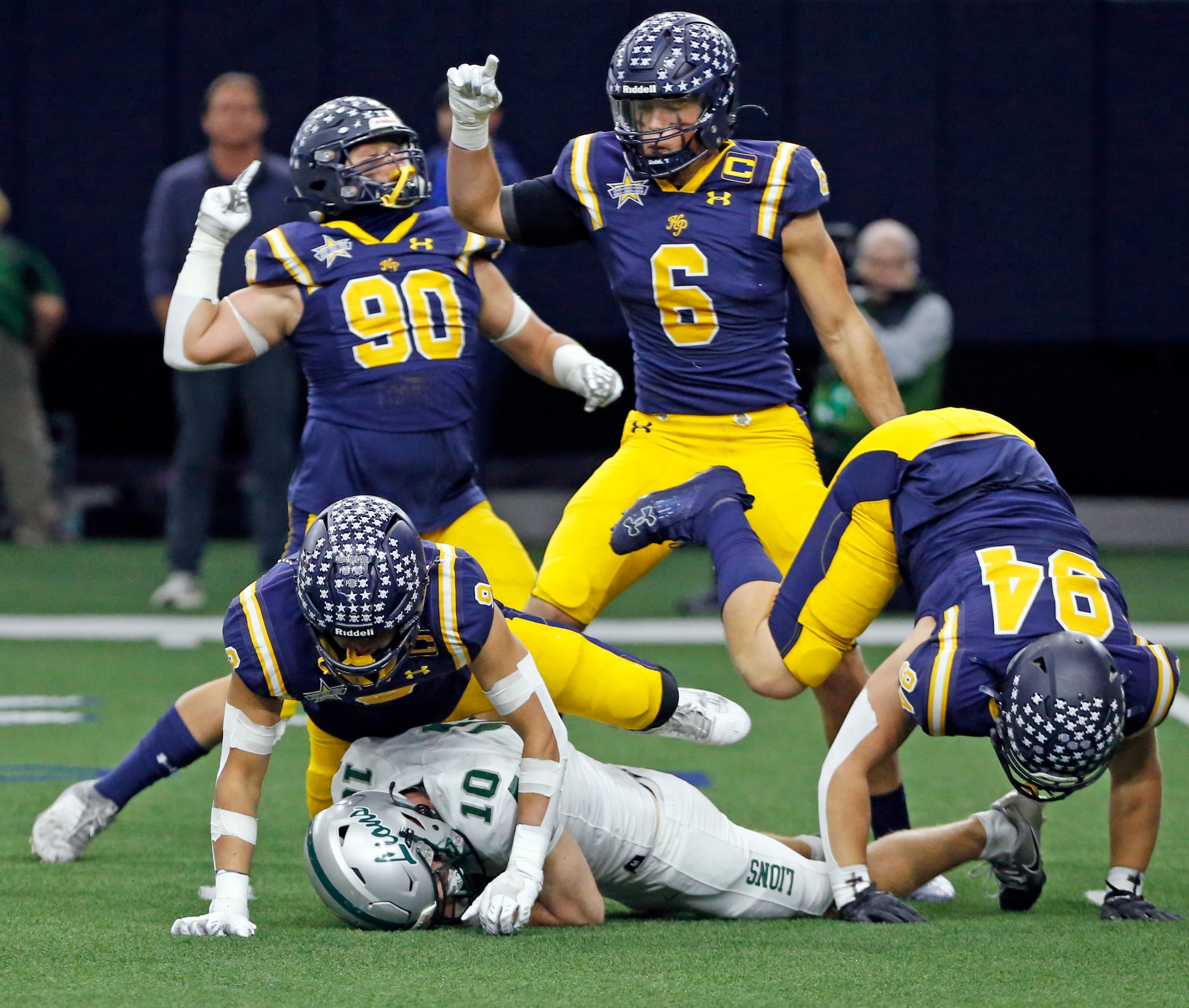 Highland Park High defender Jack Morse (9) sacks Frisco Reedy QB Jake Ferner (10), as his...