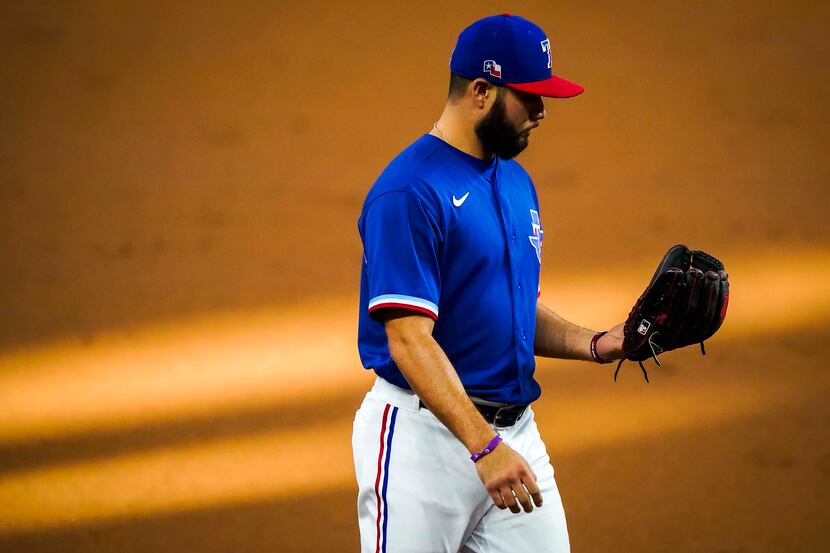 Texas Rangers infielder Isiah Kiner-Falefa plays third base during the second inning of an...