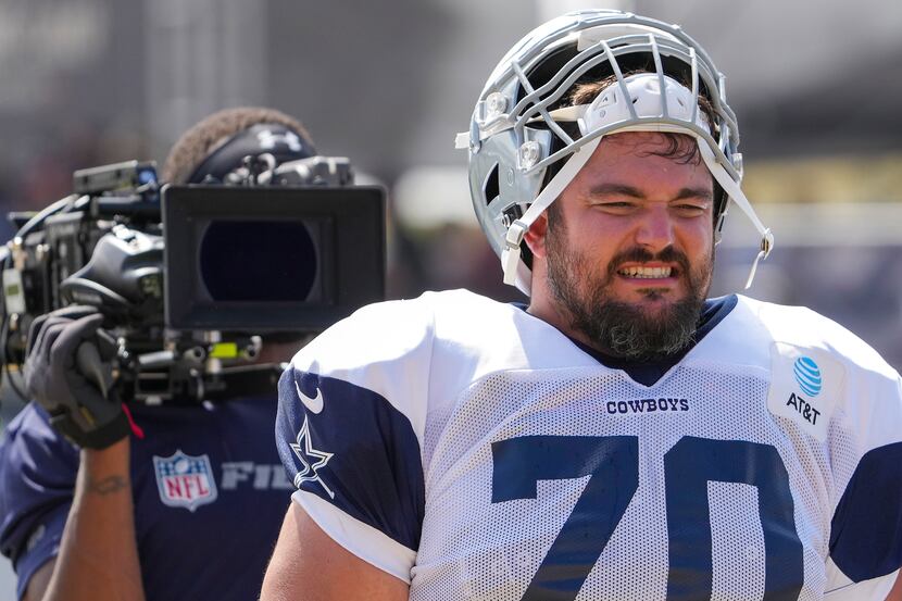 A crew from HBOs Hard Knocks trains a camera on Dallas Cowboys guard Zack Martin (70) during...