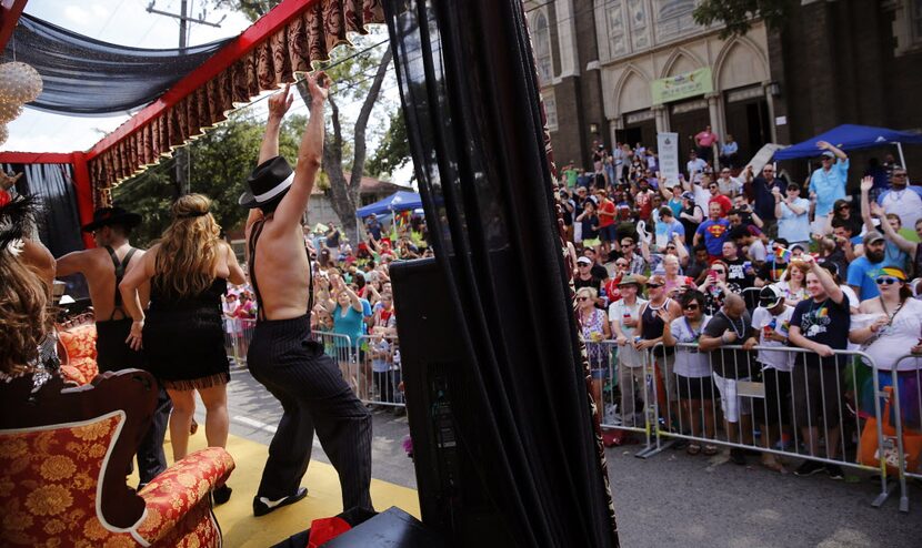 Performers on the Casa Blanca Burlesque float entertain the crowd in the Alan Ross Texas...