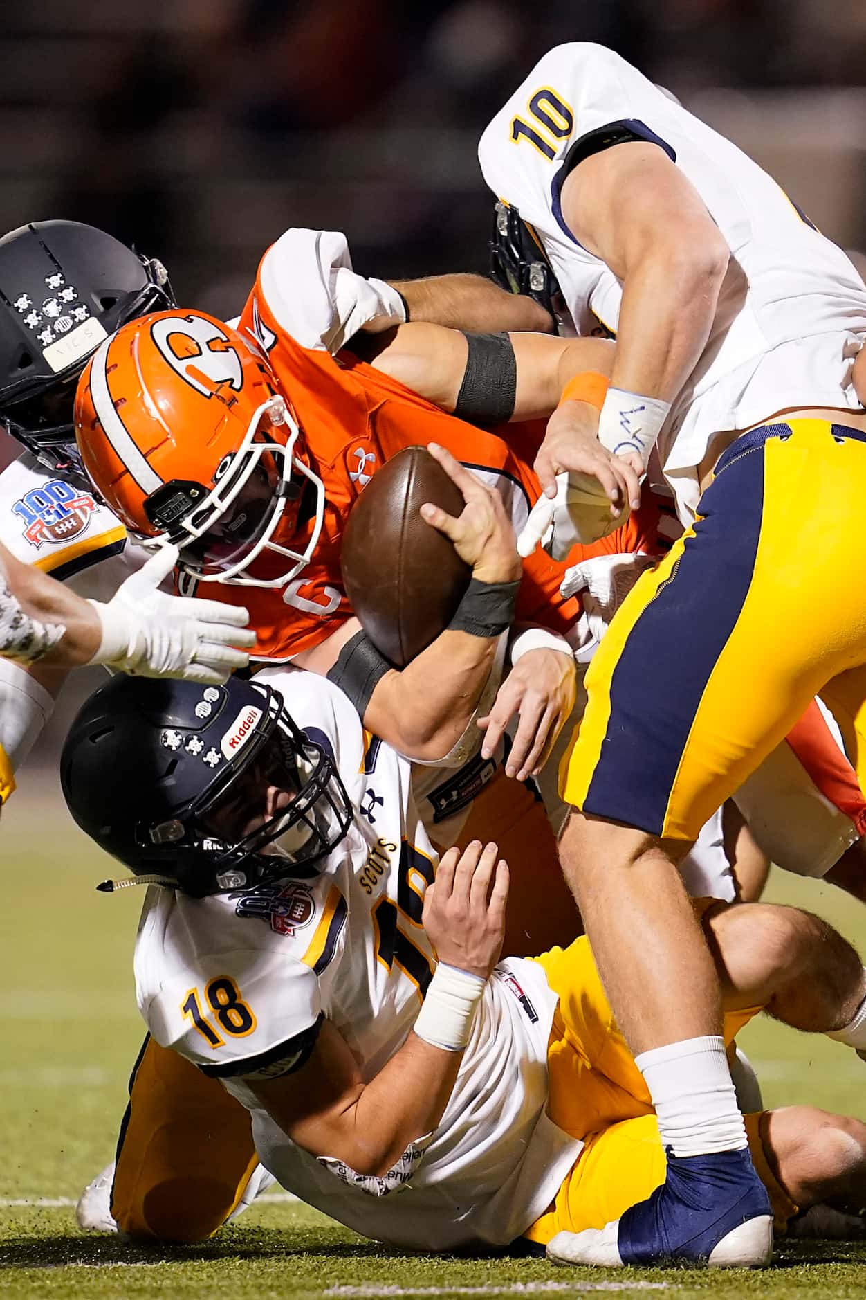 Rockwall running back Zach Hernandez (20) is brought down by Highland Park defensive back...