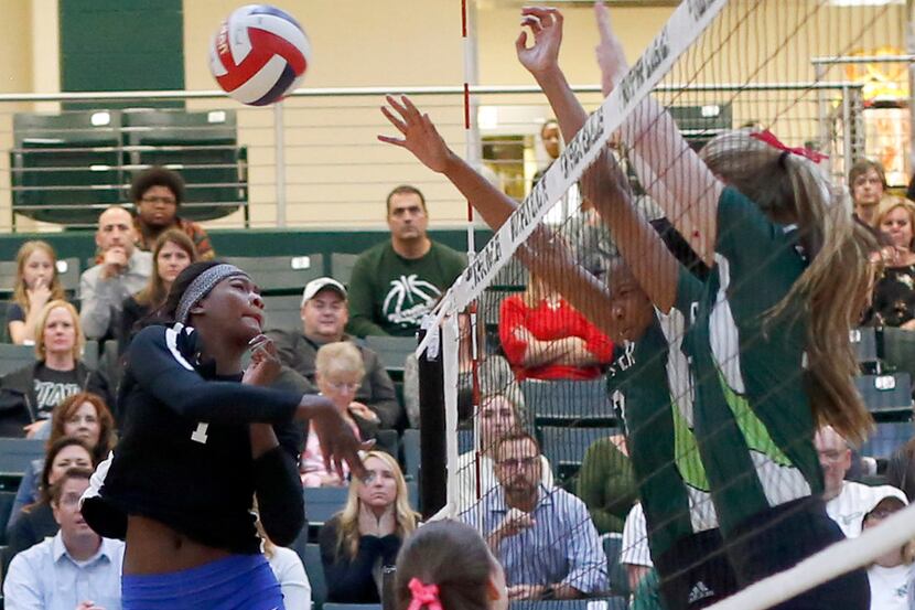 Iman Ndiaye (1) from Plano West hits a shot as Prosper's Shaylee Shore (right) and Bailey...