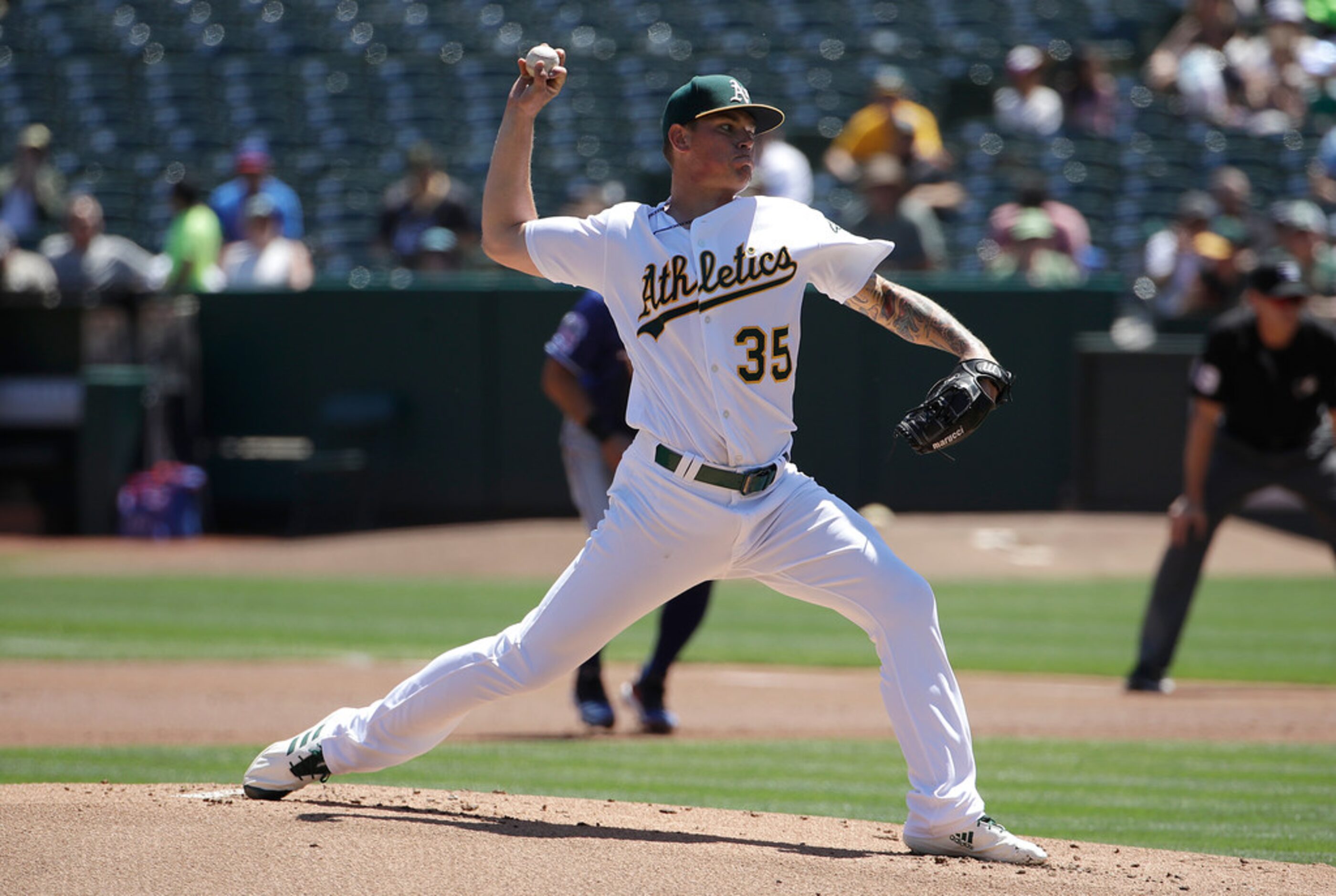 Oakland Athletics pitcher Aaron Brooks throws against the Texas Rangers during the first...