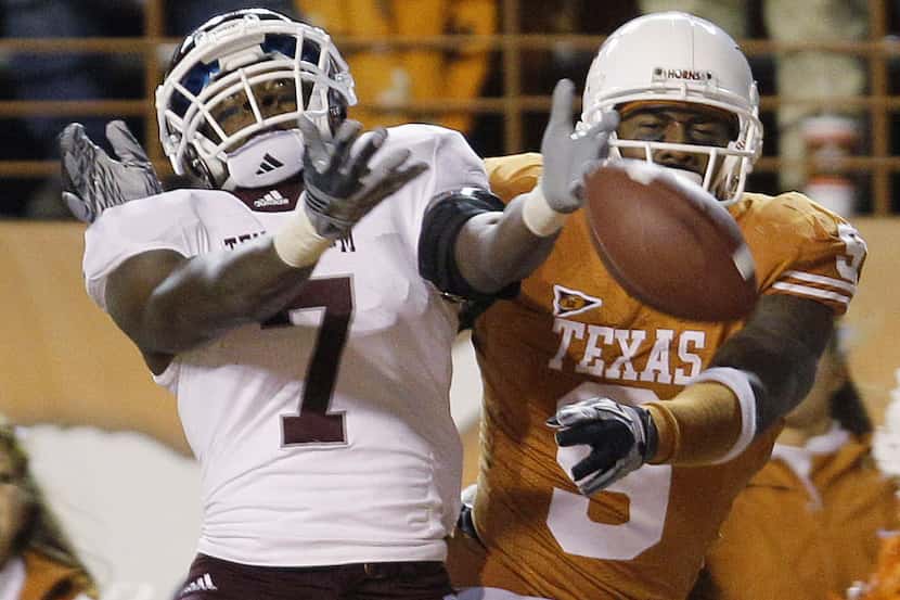 Texas A&M's Uzoma Nwachukwu (7) breaks up a pass intended for Texas' Malcolm Williams (9)...