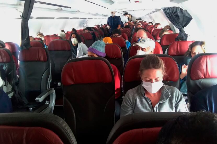 In this photo provided by a passenger who requested to be anonymous, passengers get ready...