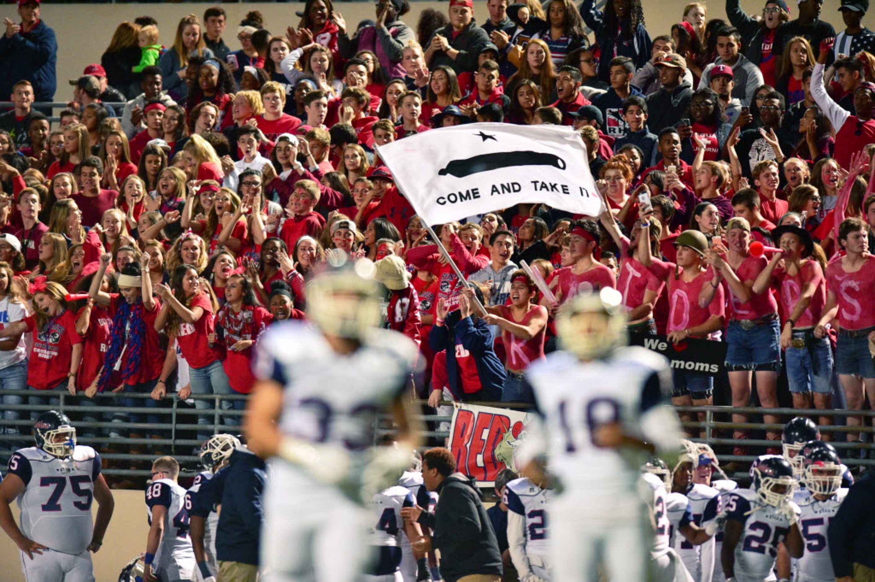 Ryan students cheer on the Raiders against Guyer, Friday, November 6, 2015, at C.H. Collins...