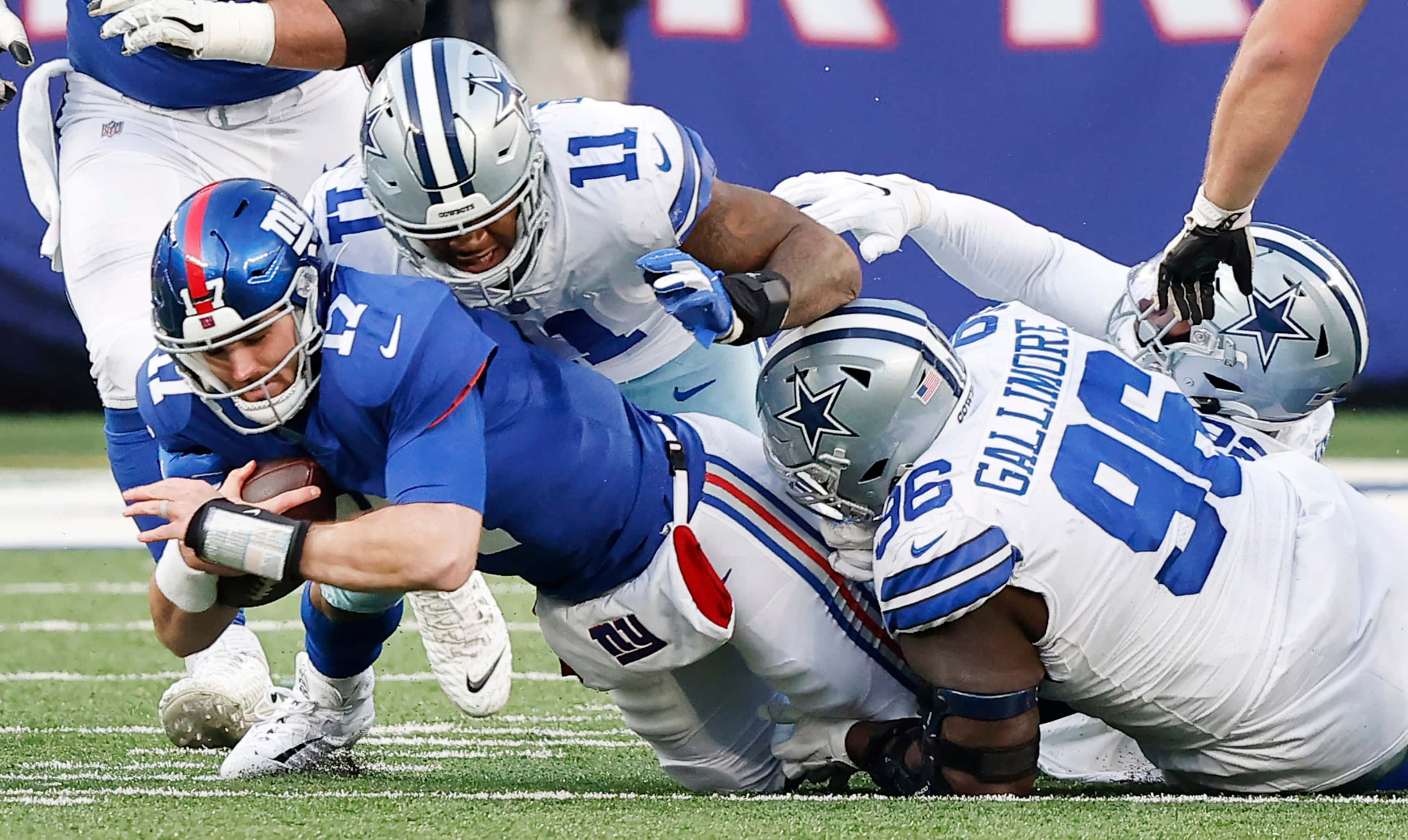 Dallas Cowboys defensive tackle Neville Gallimore (96) gets the sack of New York Giants...
