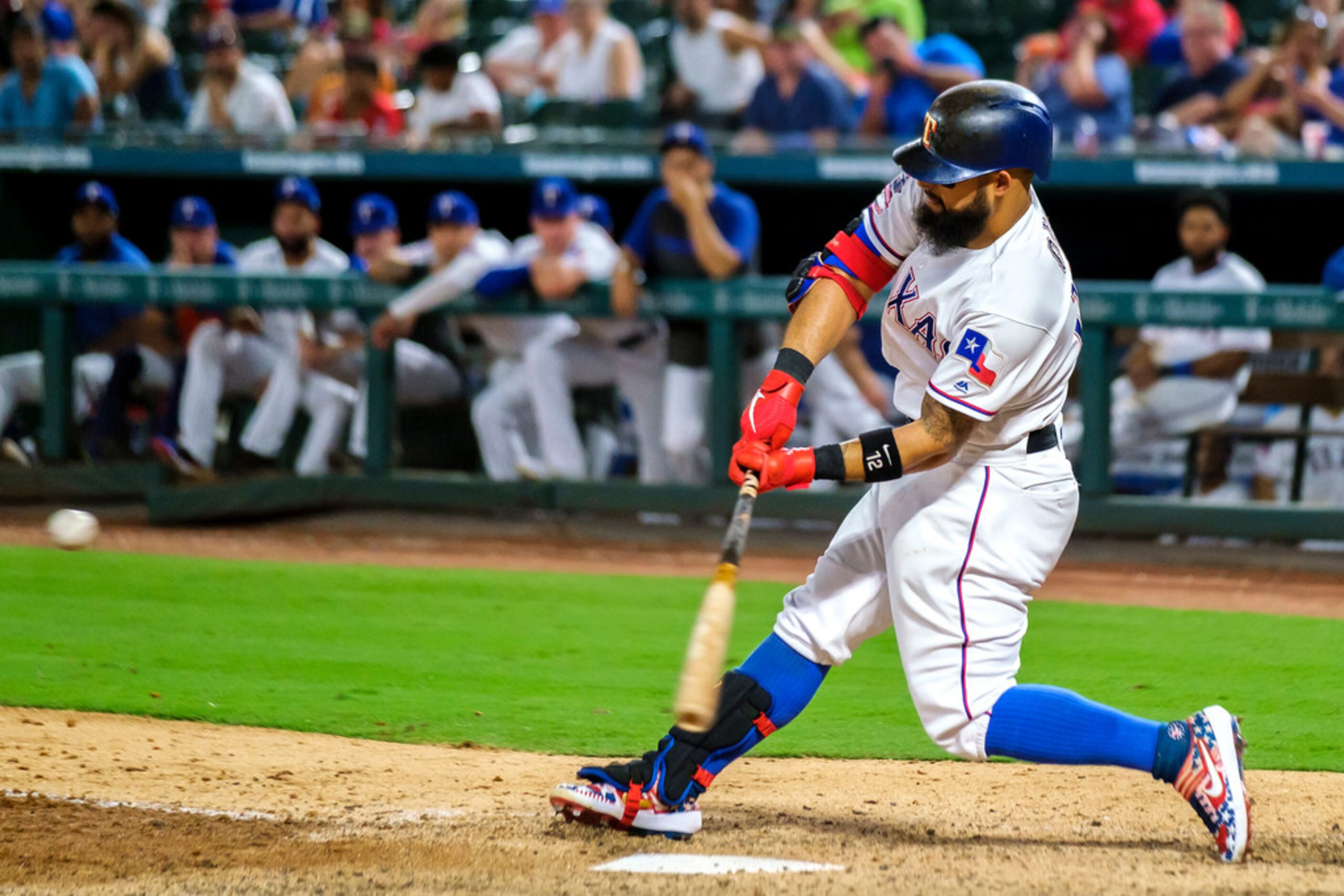 Texas Rangers second baseman Rougned Odor hits a solo home run during the seventh inning...