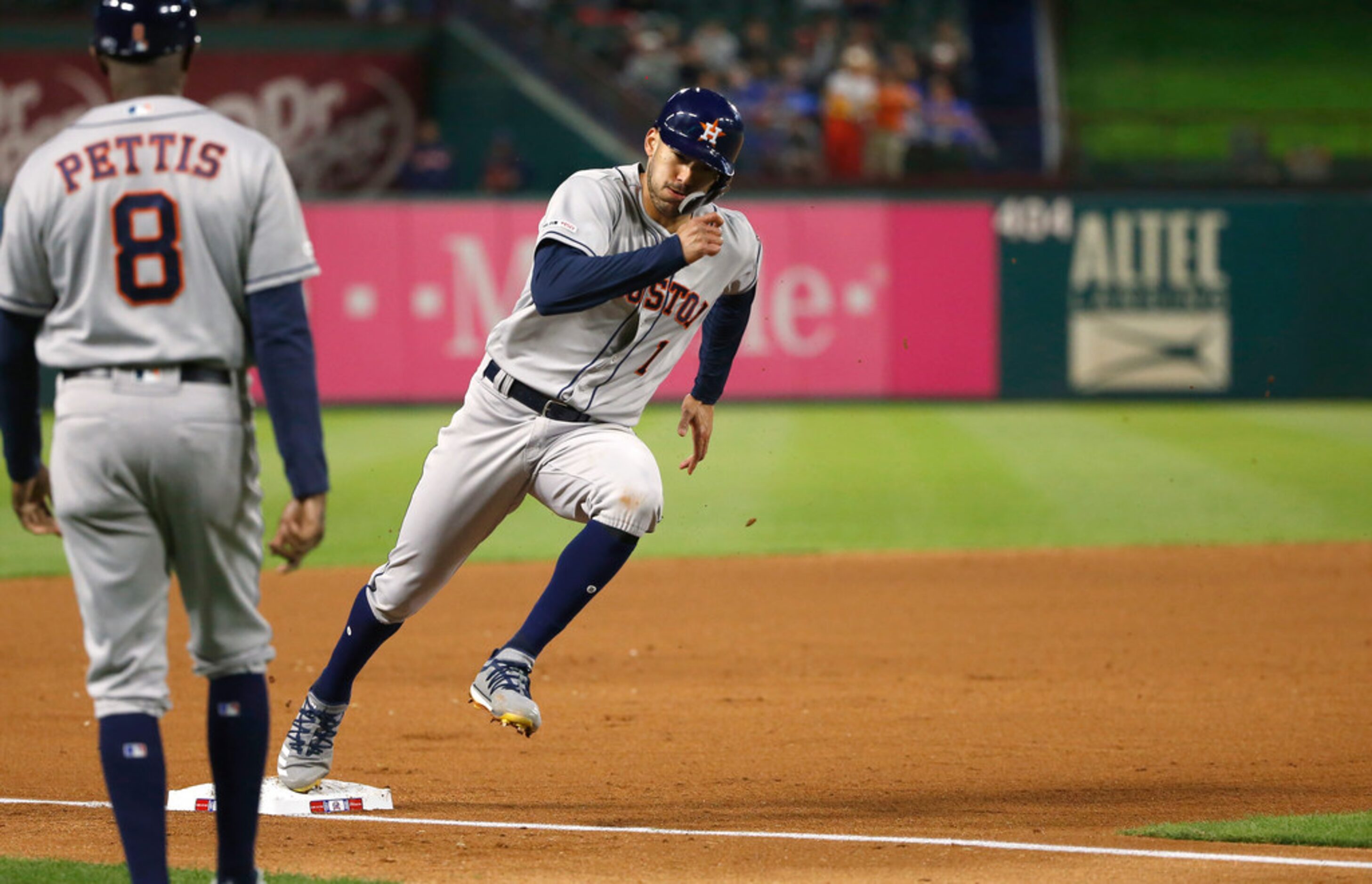 ARLINGTON, TX - APRIL 1: Carlos Correa #1 of the Houston Astros rounds third base before...