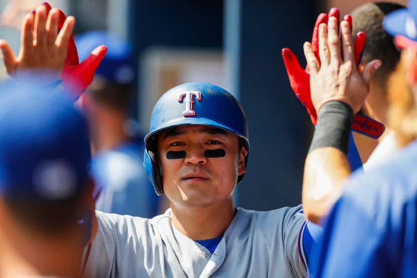 Texas Rangers Shin-Soo Choo (17) celebrates scoring a run in the sixth inning of the first...