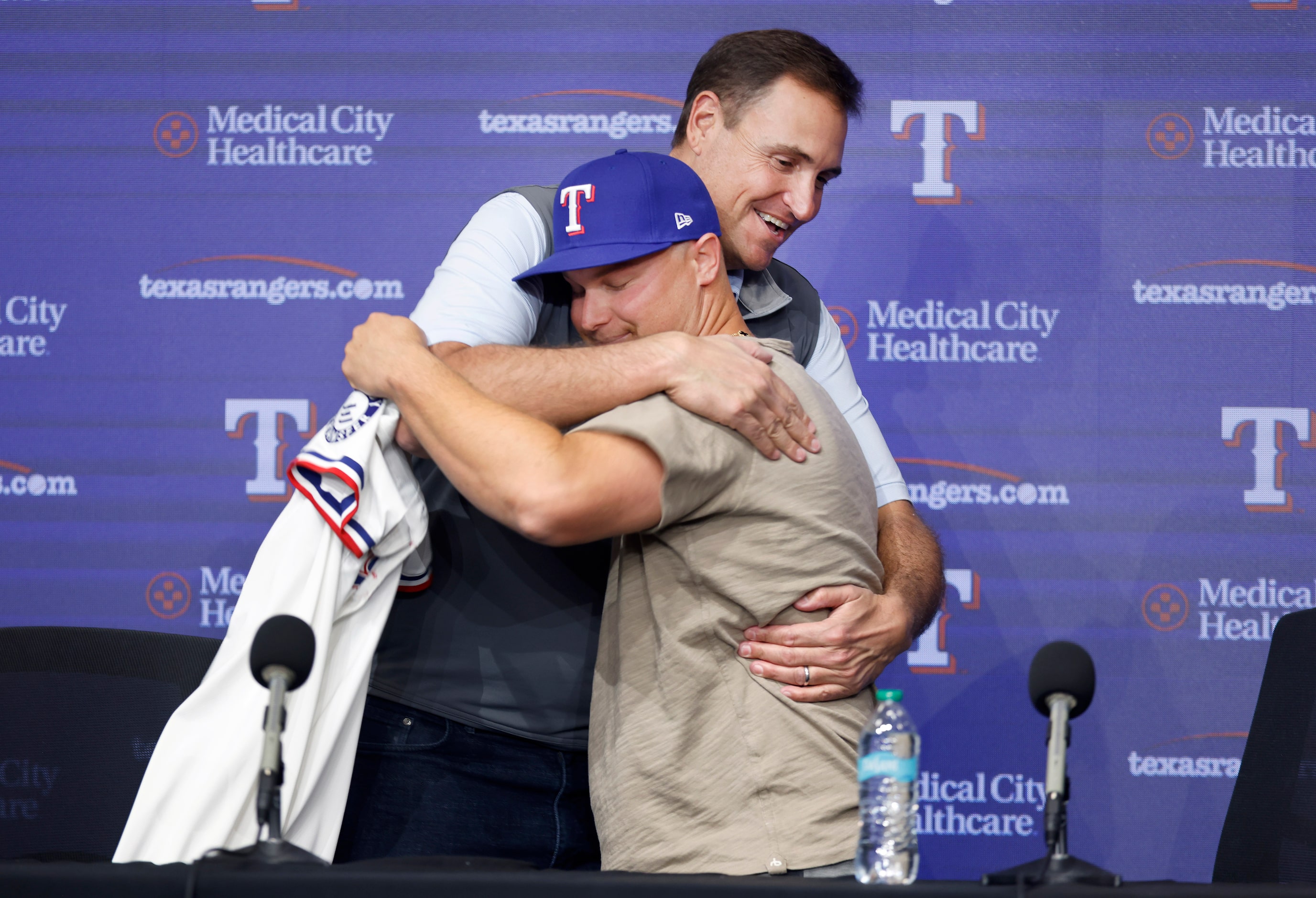 Rangers President of Baseball Operations Chris Young gives outfielder Joc Pederson, whom the...