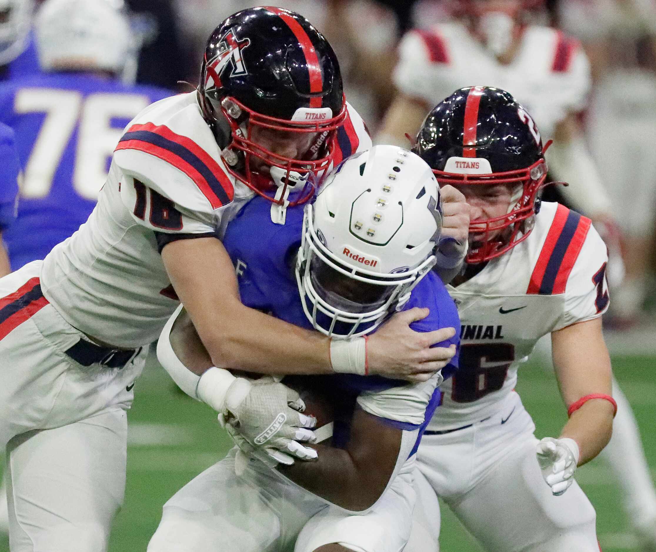 Frisco High School running back Kam Pendergraph (1) is tackled by Centennial High School...