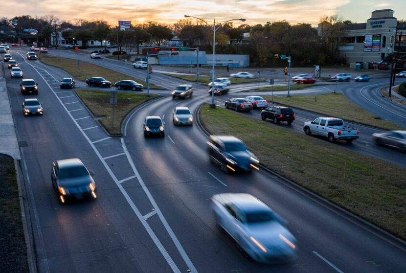 Vehicles drive through the East Grand intersection of Grand Avenue, Garland Road and Gaston...