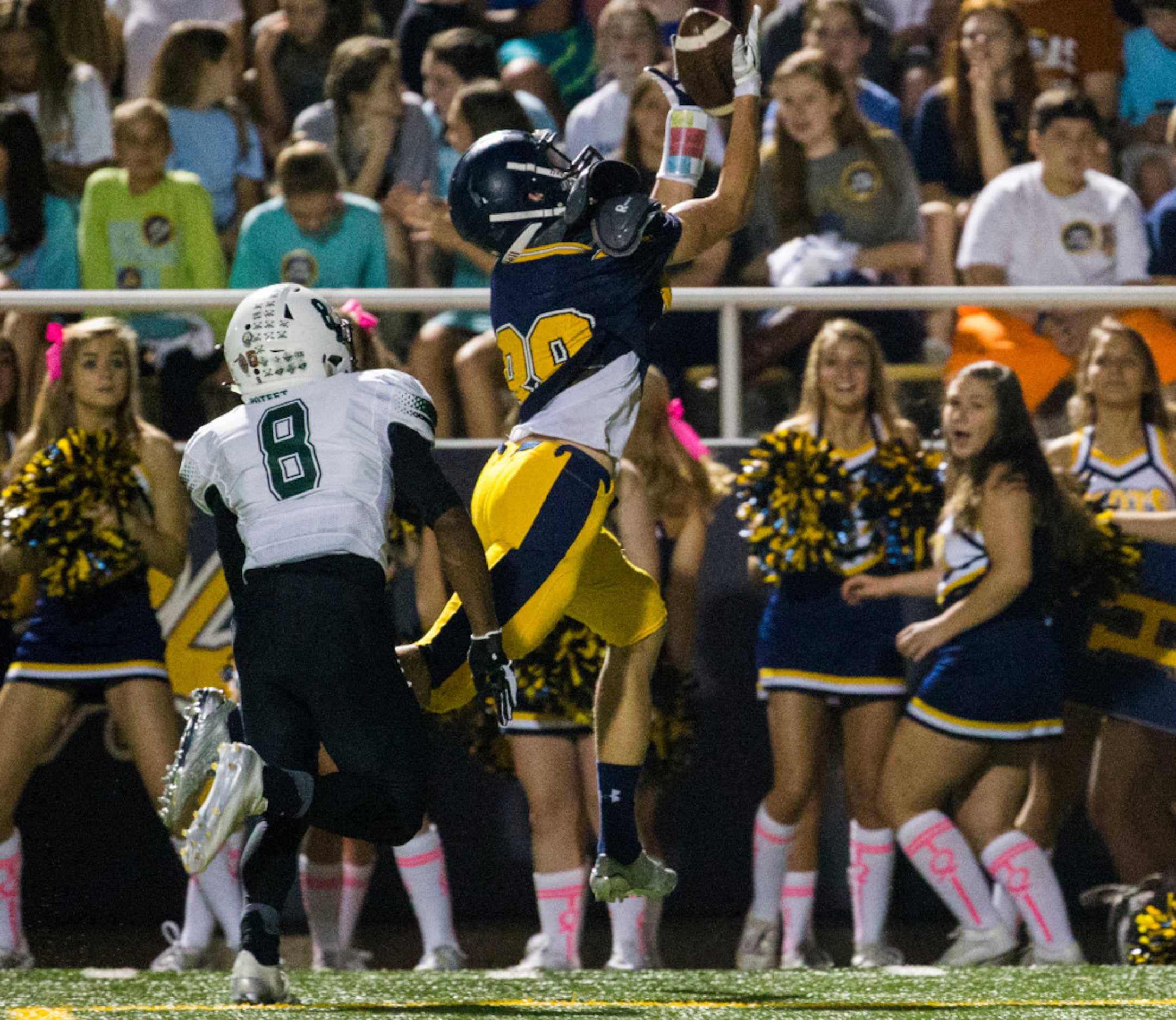 Highland Park wide receiver Cade Saustad (88) jumps up to catch a pass with Mesquite Poteet...