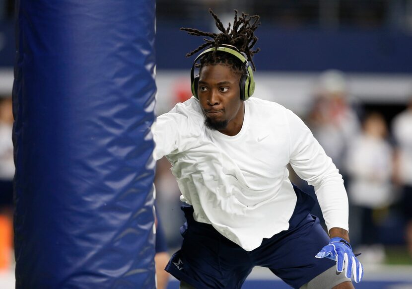 FILE - Cowboys defensive end DeMarcus Lawrence (90) works out before a game against the...