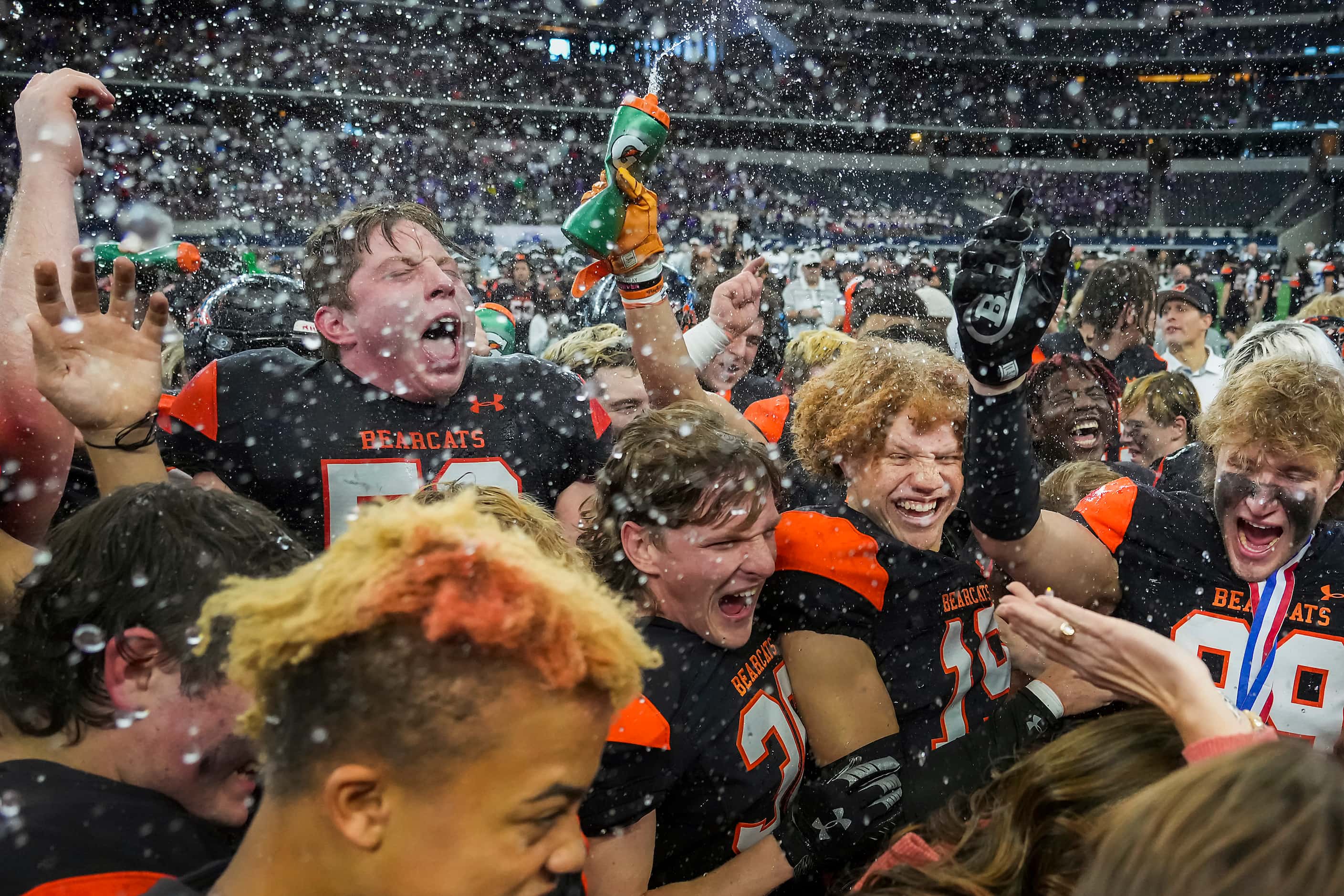 Aledo players celebrate after a victory over College Station in the Class 5A Division I...