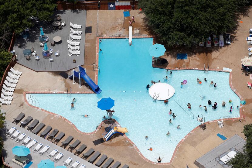 People take a break from the hot weather in The Texas Pool in Plano.