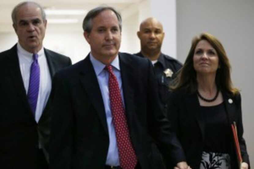  Texas Attorney General Ken Paxton and wife Angela entered the Merrill Hartman Courtroom in...
