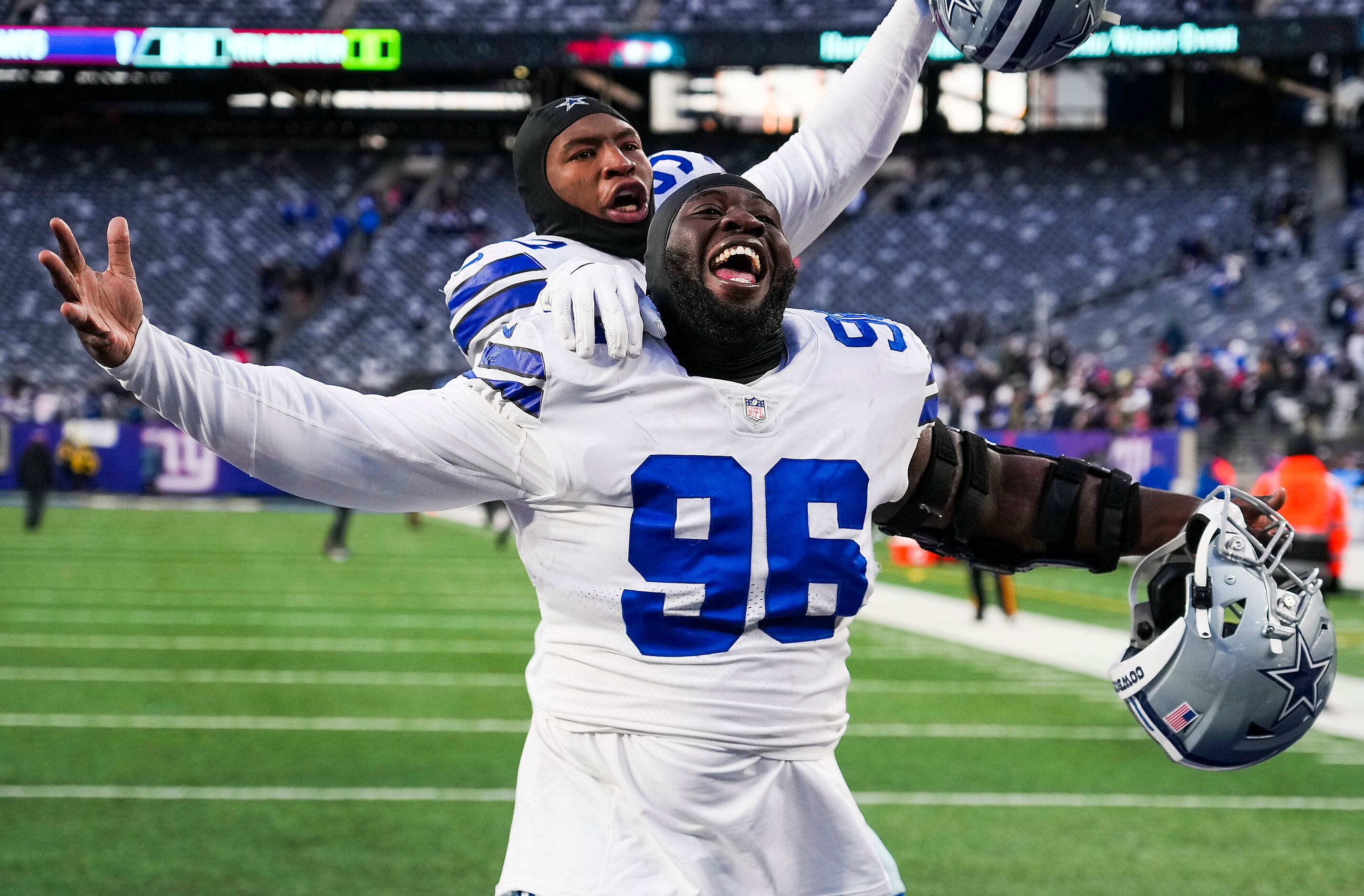 Dallas Cowboys defensive tackle Neville Gallimore (96) celebrates with fans  after an NFL football game against the New York Giants, Sunday, Dec. 19,  2021, in East Rutherford, N.J. The Dallas Cowboys defeated