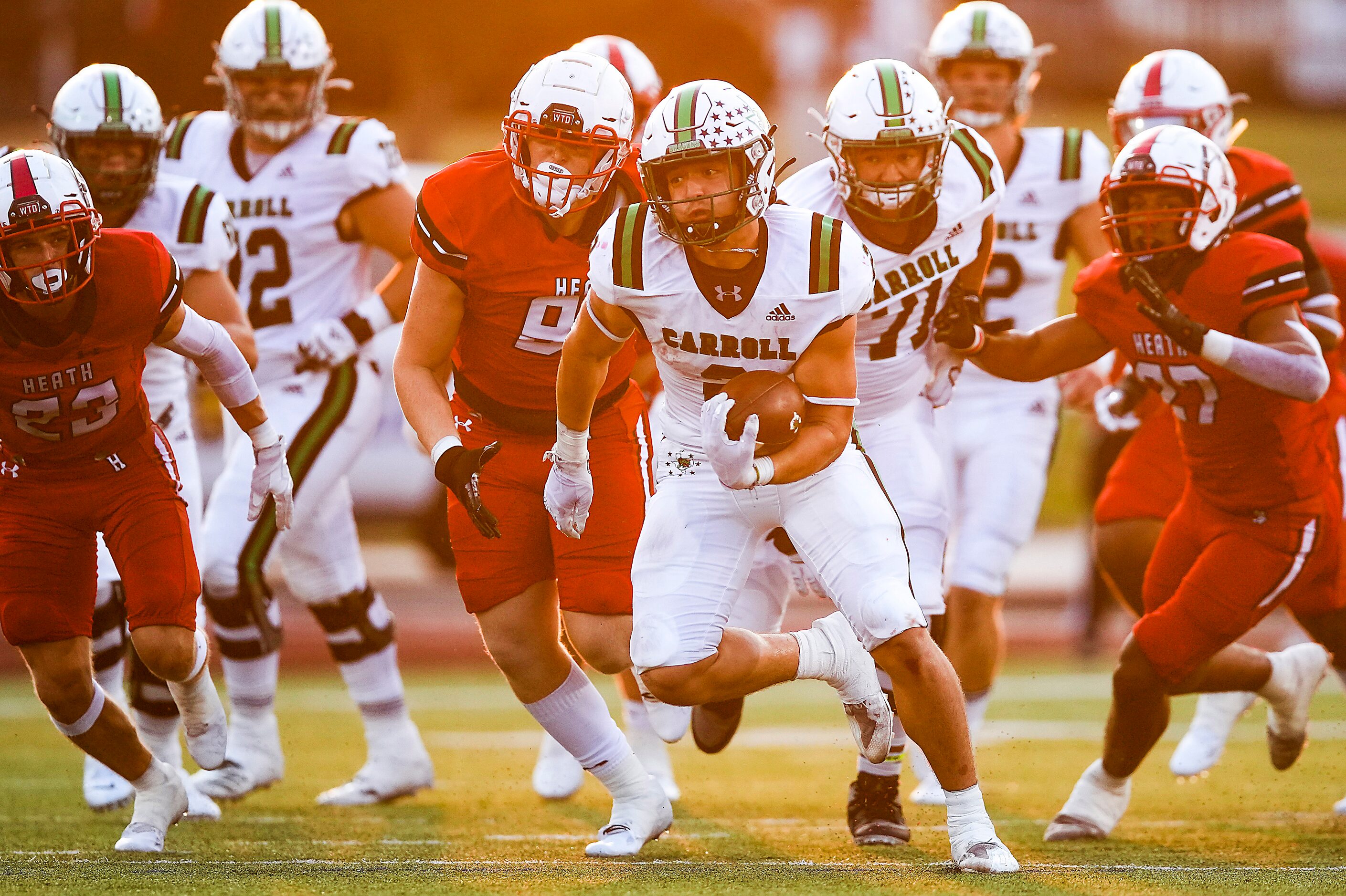 Southlake Carroll running back Owen Allen (2) cuts through the Rockwall-Heath defense during...