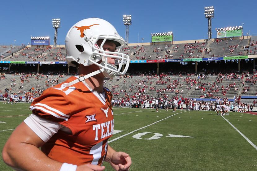 Texas Longhorns quarterback Sam Ehlinger (11)jogs off the field during early warmups before...